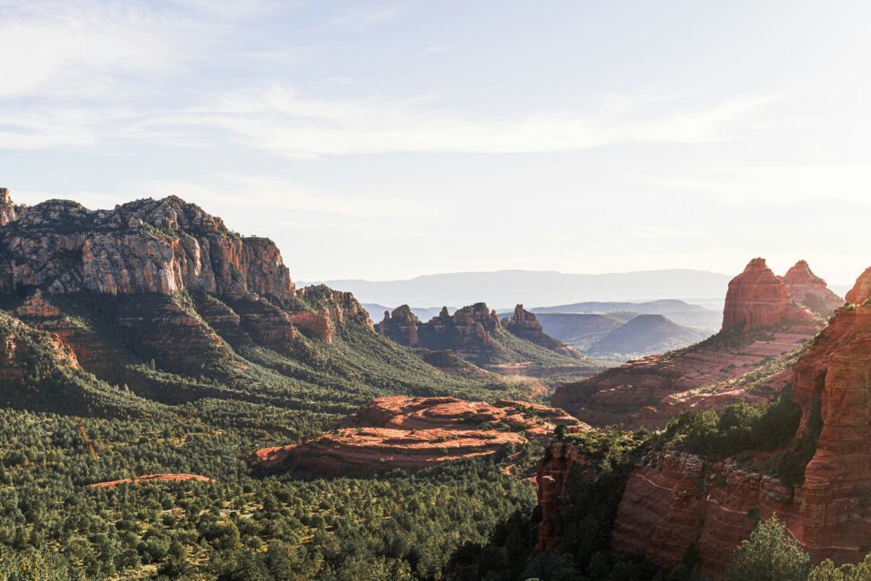 Canyon in Sedona with rocks surrounded by trees.