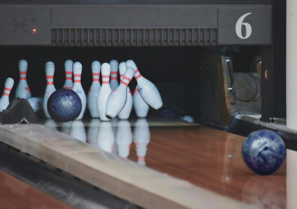 Bowling balls hitting pins in Massachusetts while escaping the hustle of bustle of daily life.