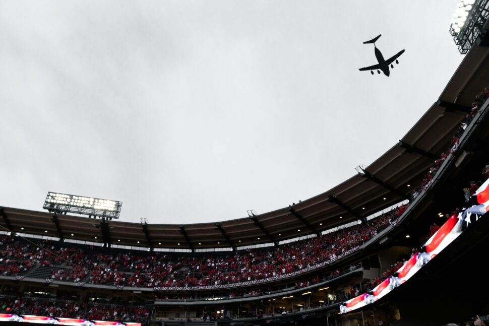 Black silhouette of a plane over Angel Stadium.