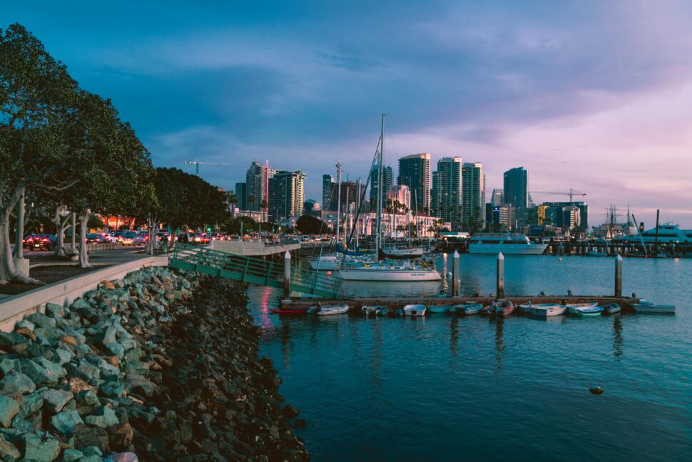 Picture of San Diego Bay at night with the city in the distance.