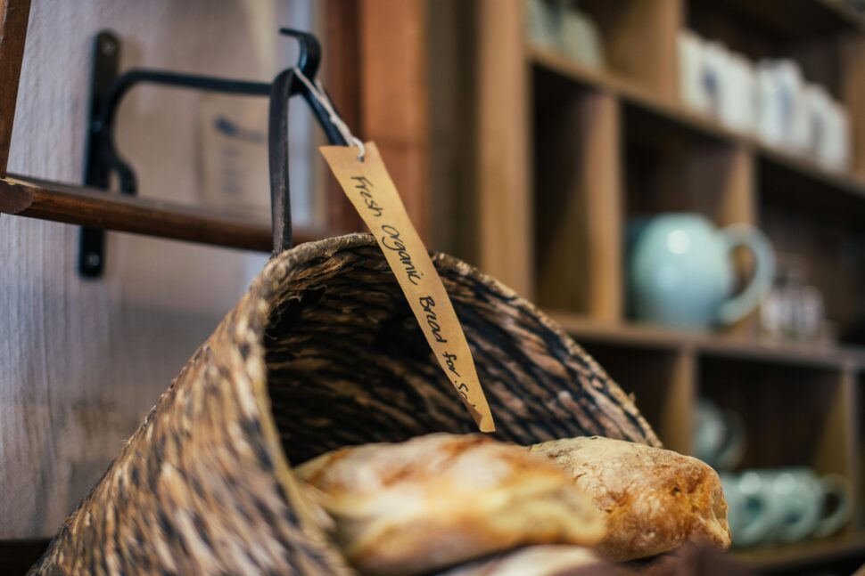 Organic bread for sale at an indoor food market.