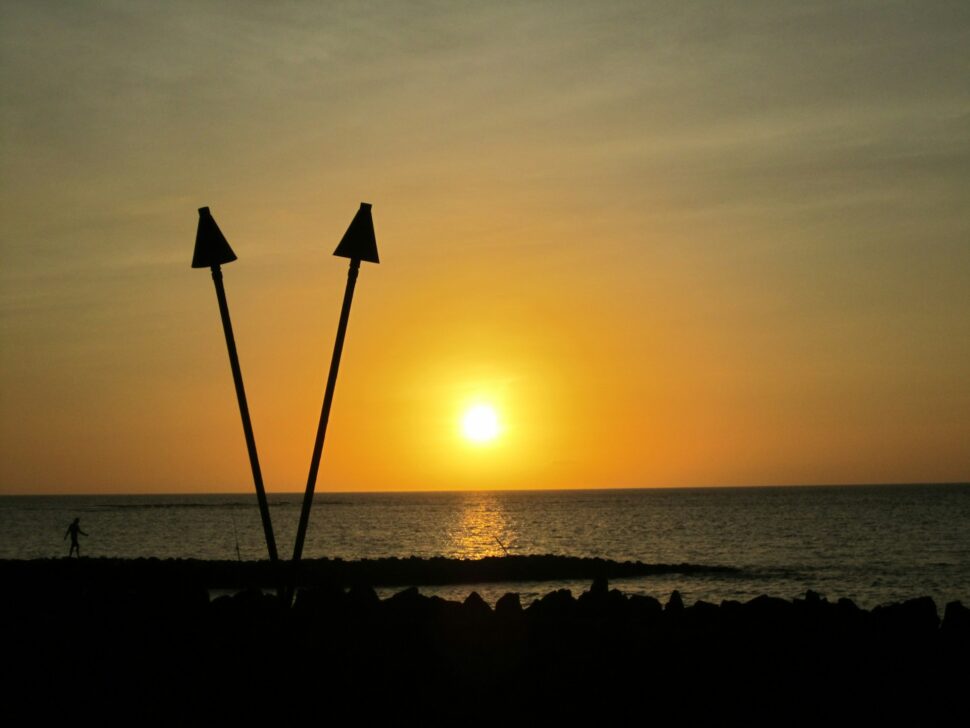 Beautiful sunset on Lahaina beach in Maui, HI. The yellow and orange sky was romantic and beautiful.