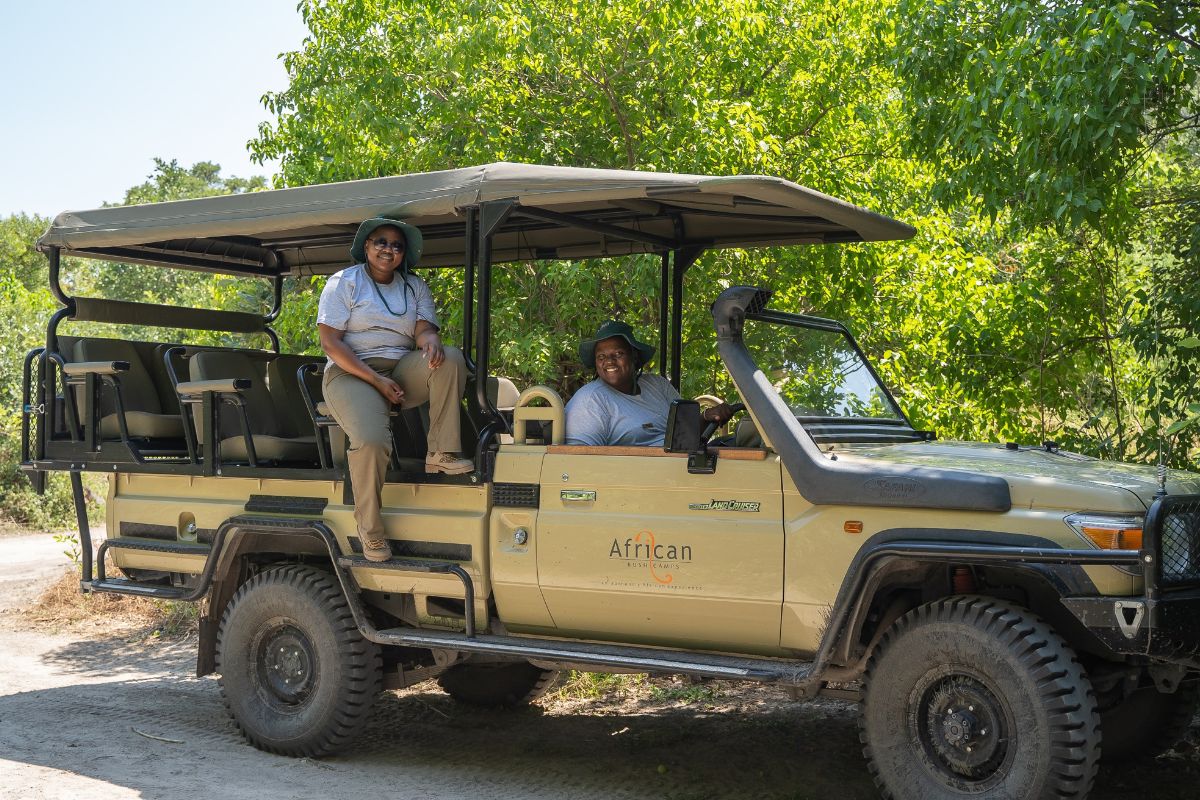 Female guides on safari truck