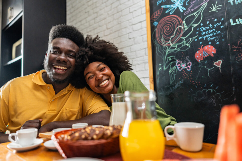 Portrait of a couple having breakfast at a hotel