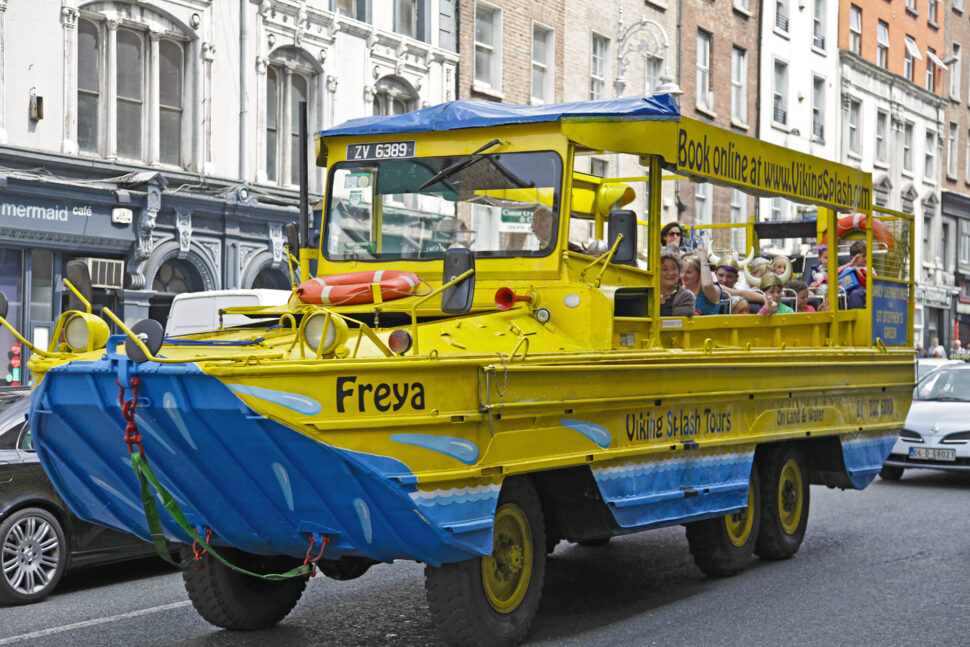 Viking Splash DUKW ('duck') in Dame Street, central Dublin with a tour group of families