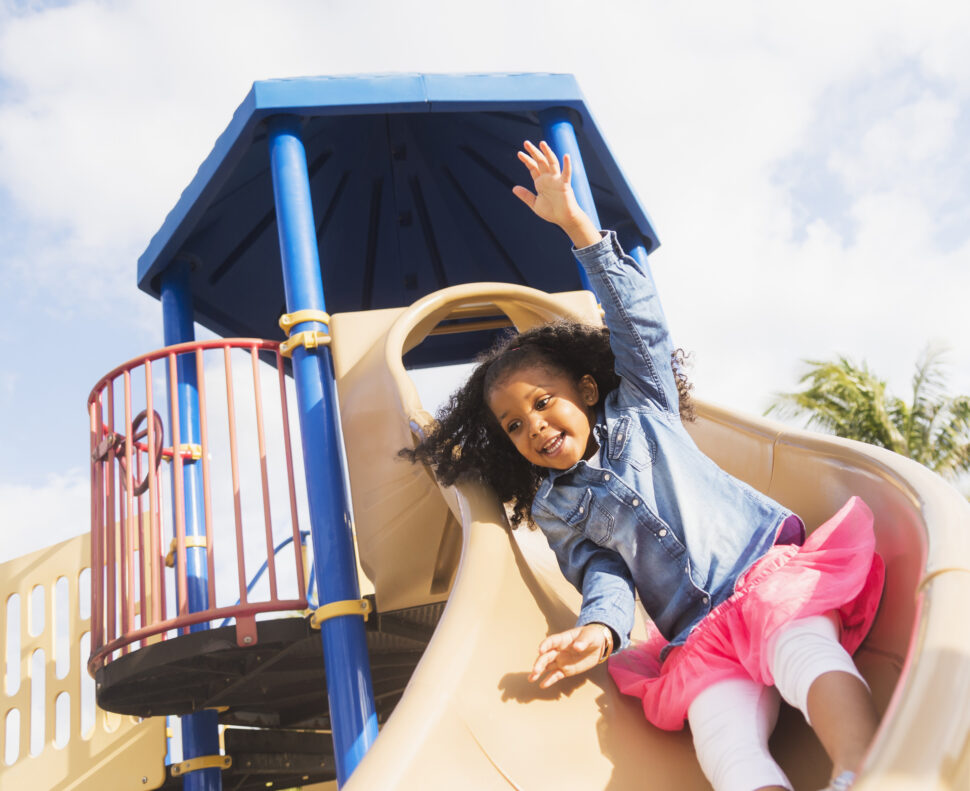 Girl playing on playground.