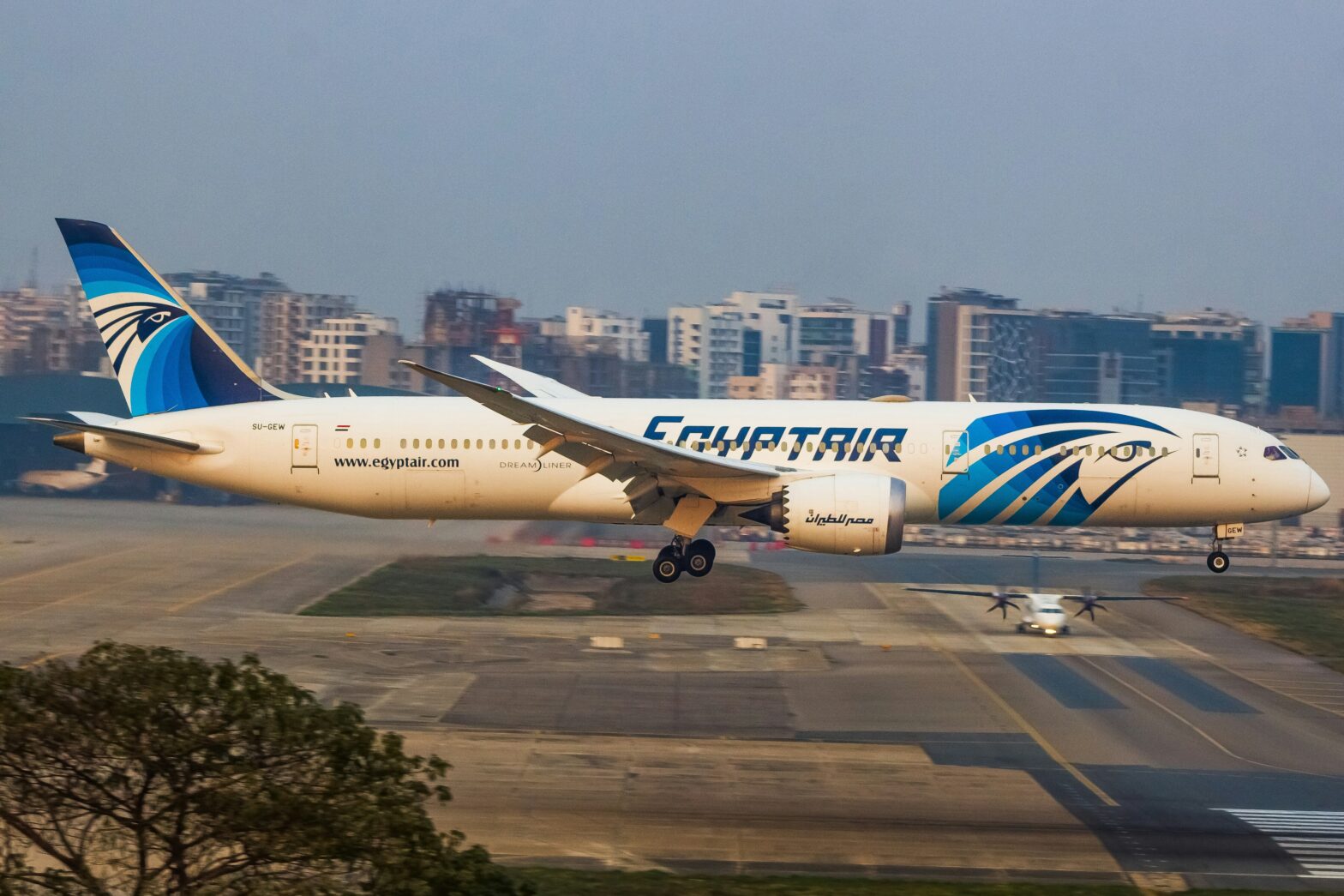 Egyptair airplane parked on tarmac.