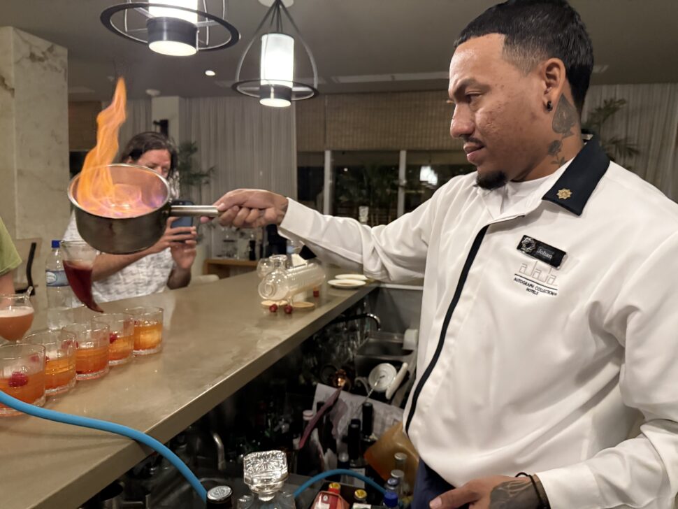 Lighting Whiskey during Molecular Mixology Experience at Arlie’s