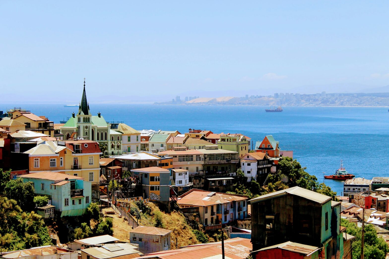 view of colorful buildings and a chapel on the coastal hillside of Valparaíso, Chile
