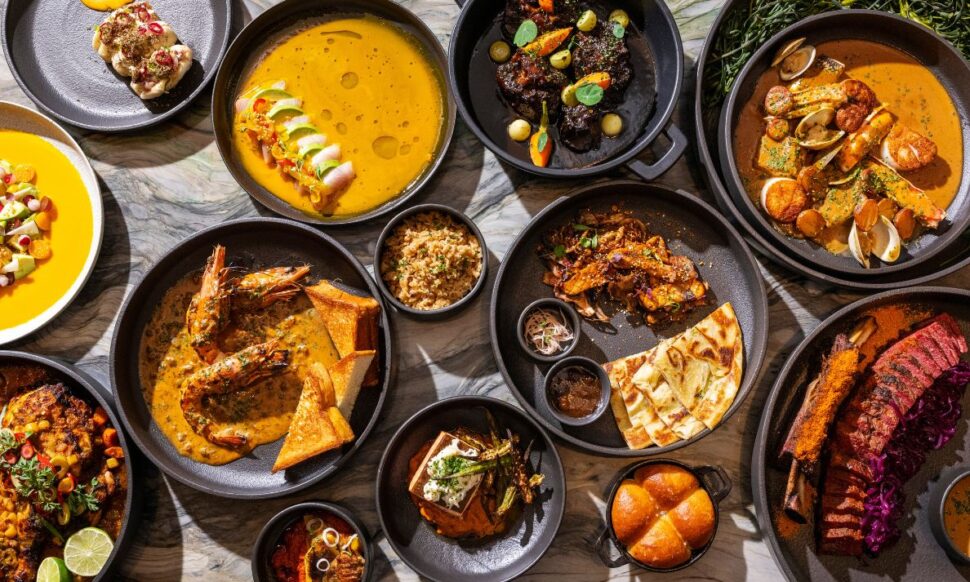 Table spread of food at Tatiana by Chef Kwame Onwuachi